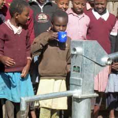 Children Drinking from New Well