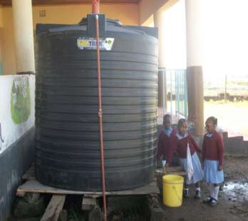 Children gathered around new tank