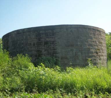 Repaired masonry tank
