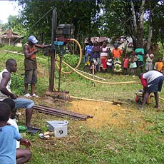 Villagers Watching Well Construction