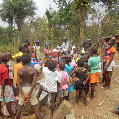 The children surround the New Well
