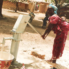 Mother with Infant at Well